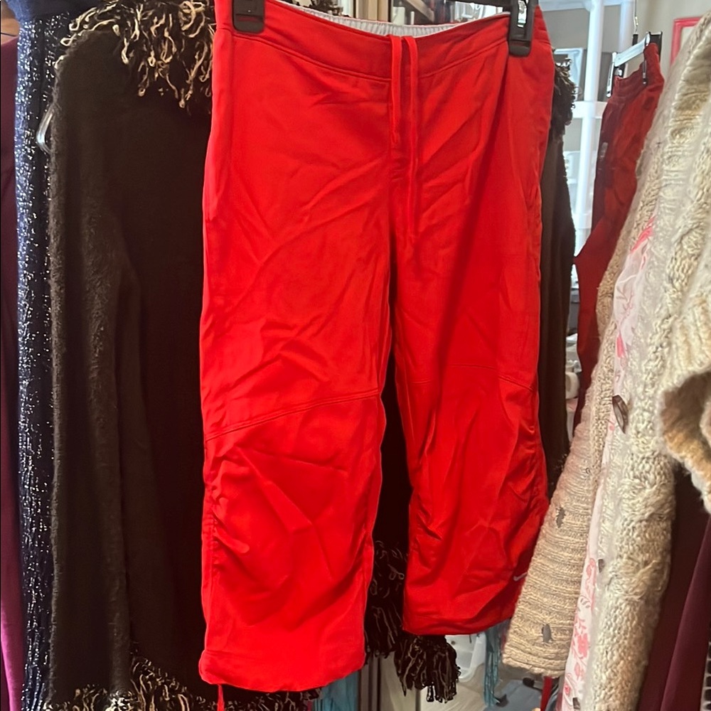 Extra small Nike Capri wind pants that are adjustable waist and cuff